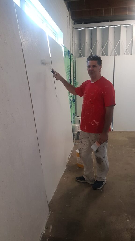 Tibor Pálinkás volunteered to paint the walls, the shutter, the boards and floors. The paint was donated by Wikes Borehamwood.